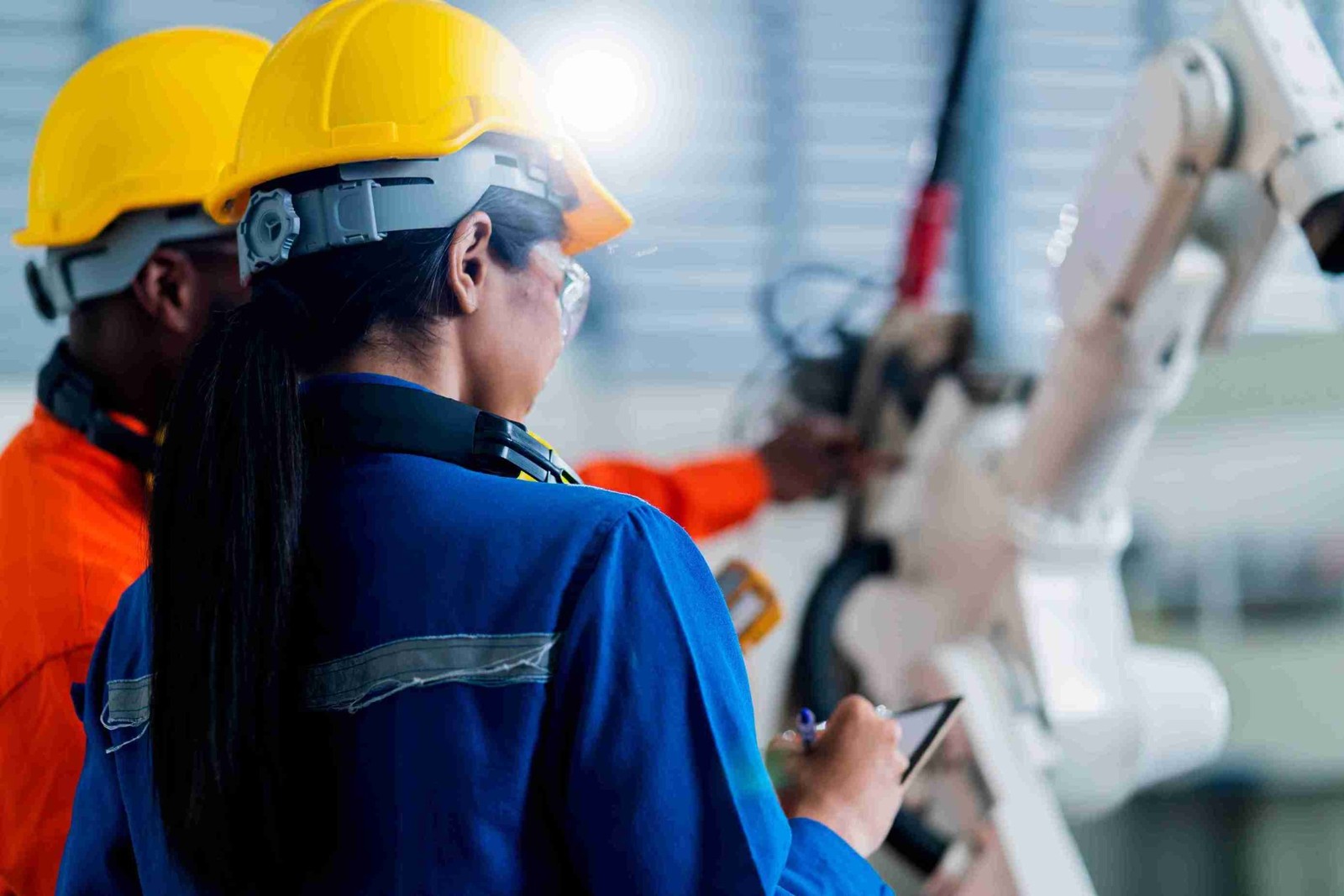 Engineers discussing industrial equipment